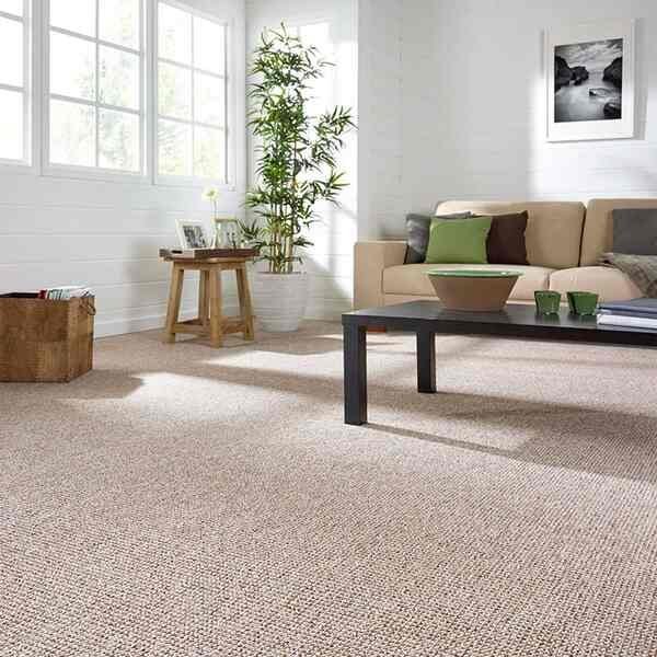 Light beige wool blend textured loop carpet installed in a bright, minimalist living room, perfect for modern and comfortable villa interiors in Dubai